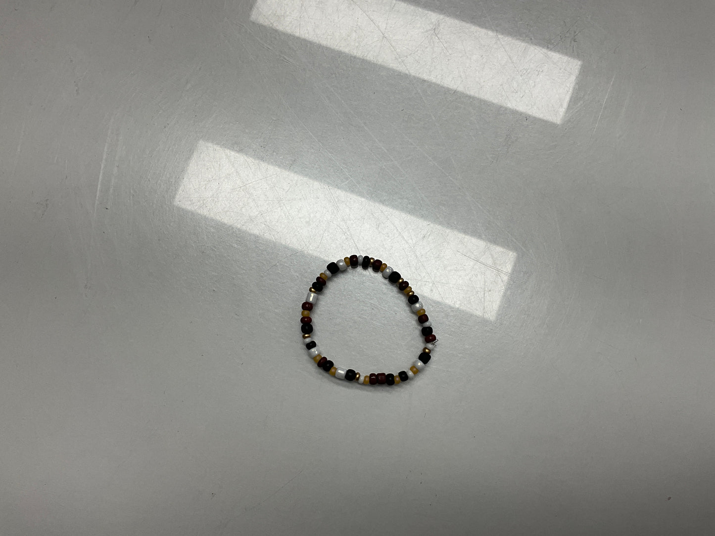 Toddler black and gold bracelet
